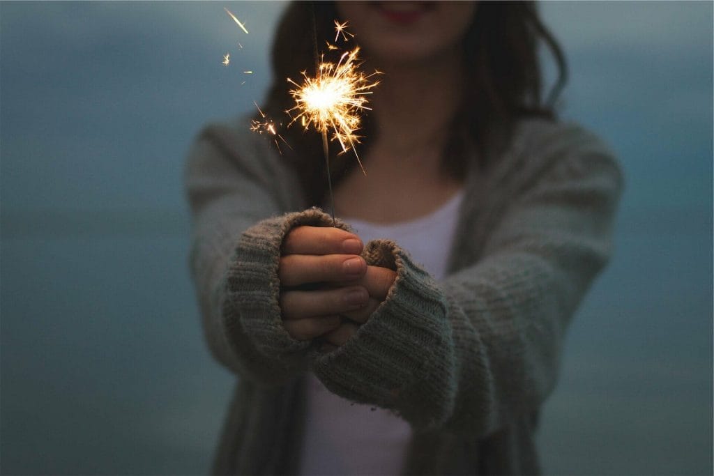 A girl holding a sparkler