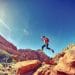 No regrets quotes and quotes on living life with no regrets - Man jumping over rock formation